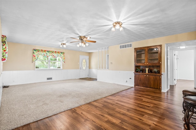 1748 Old Southmayd Rd, Sherman, TX 75092 - unfurnished living room featuring a wainscoted wall, dark wood-style floors, and ceiling fan