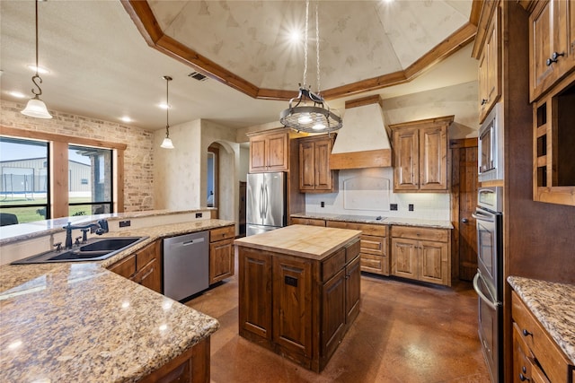13431 Kira Ln, Justin, TX 76247 - kitchen featuring stainless steel appliances, a center island, custom exhaust hood, concrete flooring, and butcher block countertops