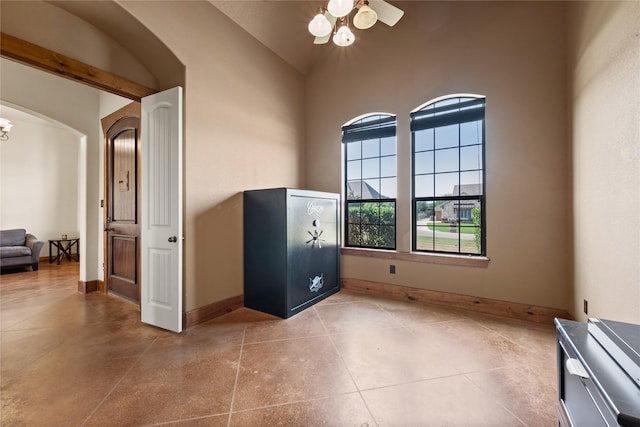 13431 Kira Ln, Justin, TX 76247 - tiled spare room with arched walkways and ceiling fan