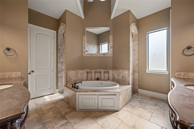 13431 Kira Ln, Justin, TX 76247 - full bathroom featuring two vanities, healthy amount of natural light, and a garden tub