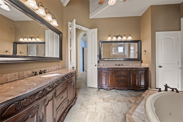 13431 Kira Ln, Justin, TX 76247 - bathroom with vanity, a tub with jets, and a ceiling fan