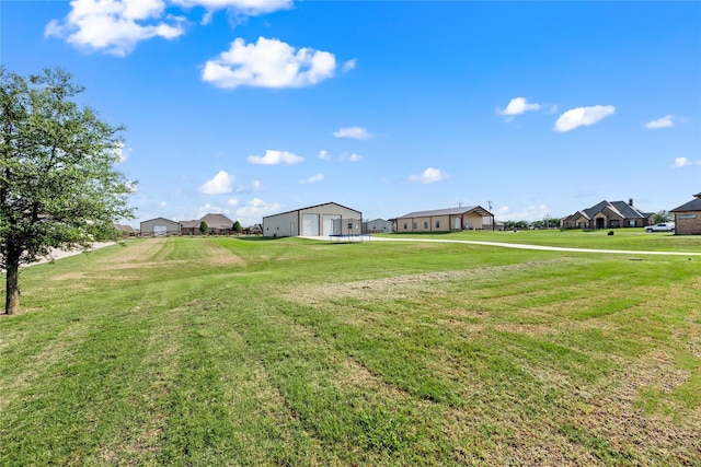 13431 Kira Ln, Justin, TX 76247 - view of green lawn with a garage and a residential view