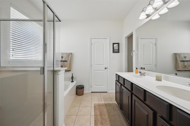 1000 Barn Owl Dr, Little Elm, TX 75068 - full bath with double vanity, tile patterned flooring, healthy amount of natural light, and a garden tub