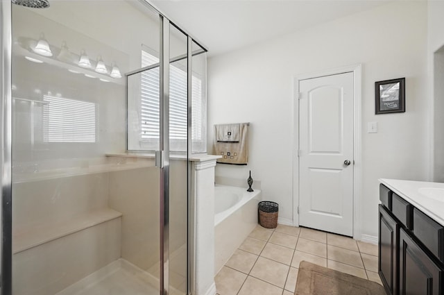 1000 Barn Owl Dr, Little Elm, TX 75068 - bathroom featuring a stall shower, a garden tub, vanity, and tile patterned flooring