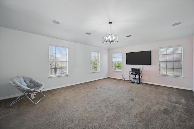 1000 Barn Owl Dr, Little Elm, TX 75068 - unfurnished living room with a chandelier and dark carpet