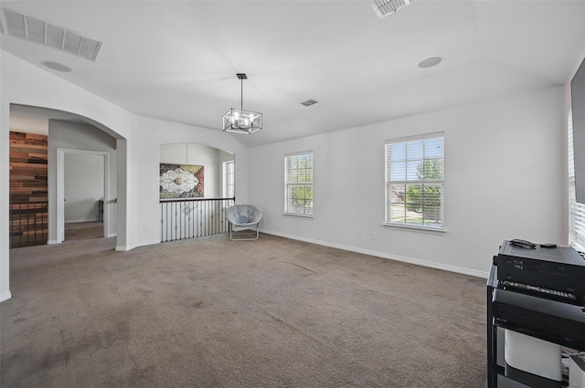1000 Barn Owl Dr, Little Elm, TX 75068 - unfurnished dining area with carpet, vaulted ceiling, arched walkways, and a chandelier