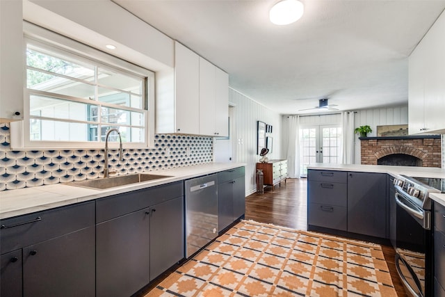 2528 Royal Ln, Denton, TX 76209 - kitchen with appliances with stainless steel finishes, decorative backsplash, and light countertops