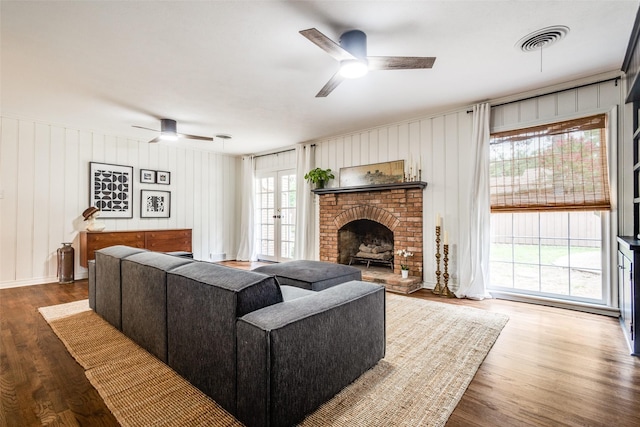 2528 Royal Ln, Denton, TX 76209 - living area featuring ceiling fan, wood finished floors, and a fireplace