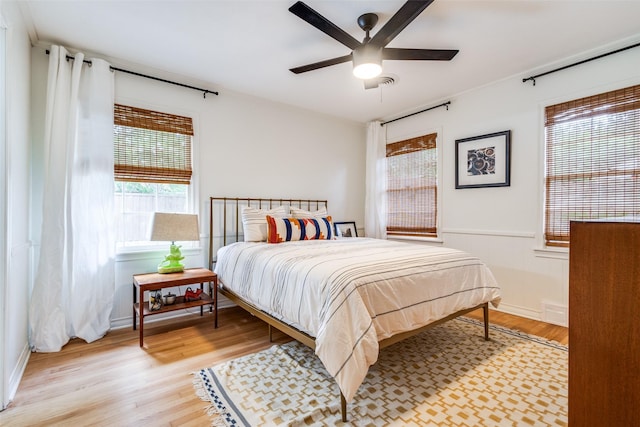 2528 Royal Ln, Denton, TX 76209 - bedroom with light wood finished floors and a ceiling fan