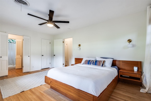 2528 Royal Ln, Denton, TX 76209 - bedroom with wood finished floors and ceiling fan