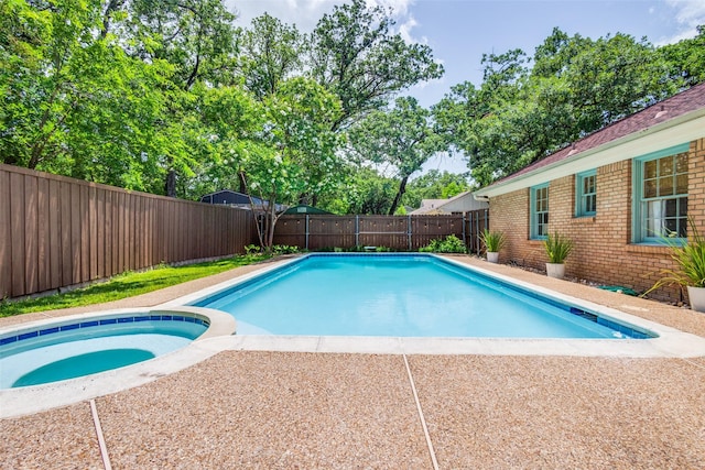 2528 Royal Ln, Denton, TX 76209 - view of pool with a fenced backyard and a pool with connected hot tub
