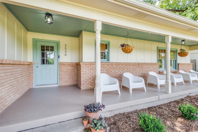 2528 Royal Ln, Denton, TX 76209 - doorway to property with brick siding and a porch