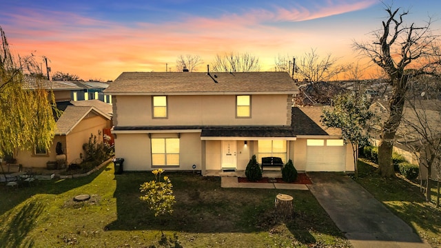 2648 Mark Dr, Mesquite, TX 75150 - traditional home with stucco siding, a front yard, a garage, and a shingled roof