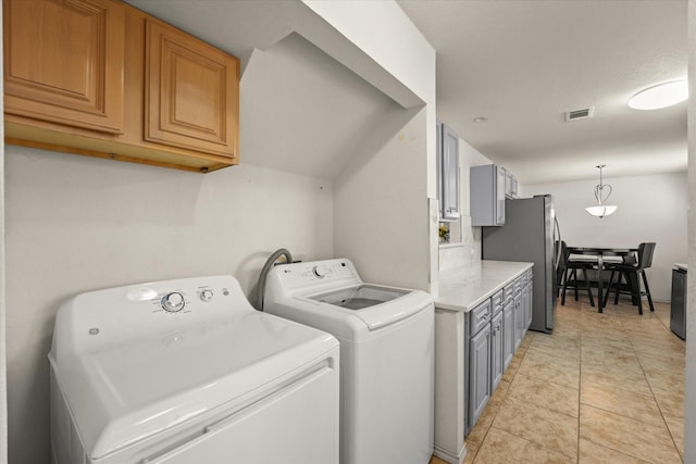 2648 Mark Dr, Mesquite, TX 75150 - laundry area featuring washing machine and clothes dryer and light tile patterned floors