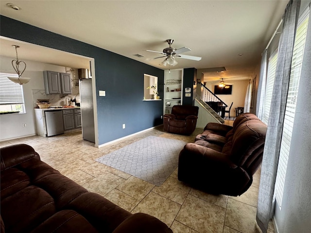 2648 Mark Dr, Mesquite, TX 75150 - living room featuring stairway, a ceiling fan, and light tile patterned flooring