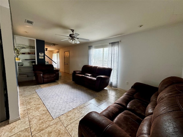 2648 Mark Dr, Mesquite, TX 75150 - living room with ceiling fan, tile patterned floors, and stairs