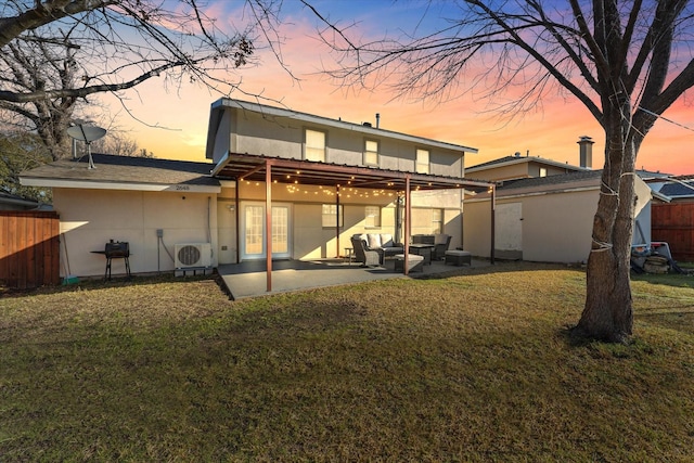 2648 Mark Dr, Mesquite, TX 75150 - back of property at dusk featuring an outdoor living space, a patio, stucco siding, and an outbuilding