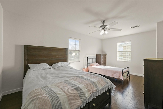 2648 Mark Dr, Mesquite, TX 75150 - bedroom with a ceiling fan and dark wood-style flooring