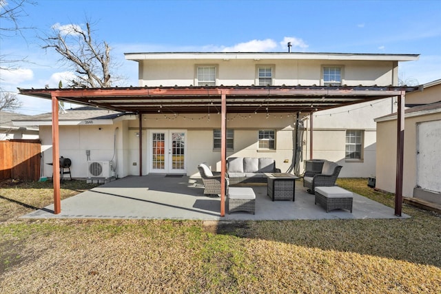 2648 Mark Dr, Mesquite, TX 75150 - rear view of property with french doors, an outdoor living space, stucco siding, and a patio