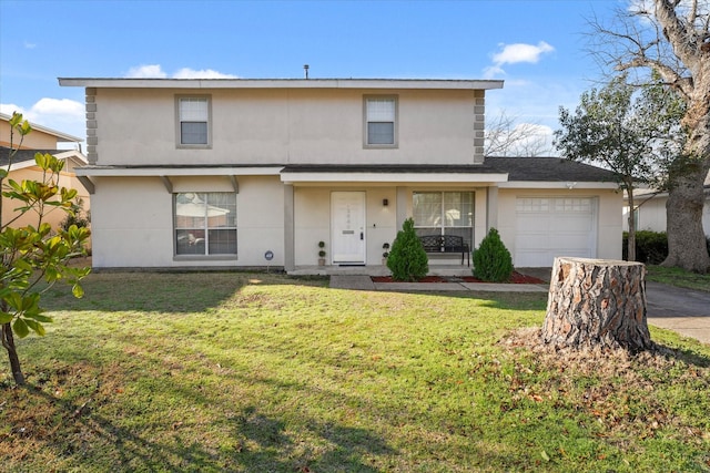 2648 Mark Dr, Mesquite, TX 75150 - traditional-style house featuring a garage, a front yard, stucco siding, and driveway