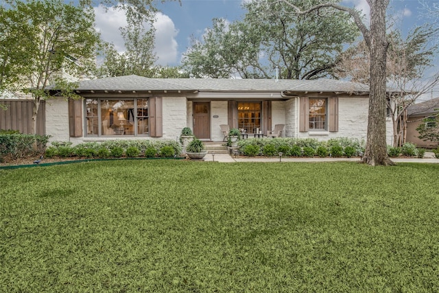 6110 Del Norte Ln, Dallas, TX 75225 - single story home with a porch, a front yard, and stone siding