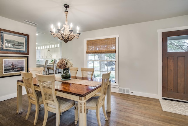 6110 Del Norte Ln, Dallas, TX 75225 - dining space with a chandelier and wood finished floors