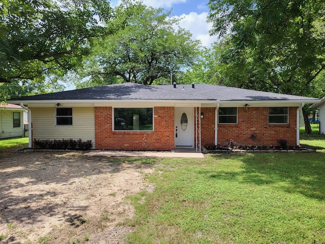 2410 W Collin St, Corsicana, TX 75110 - view of front of house featuring a front yard and brick siding