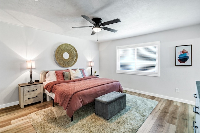 7116 Chapman Dr, North Richland Hills, TX 76182 - bedroom with light wood finished floors and ceiling fan