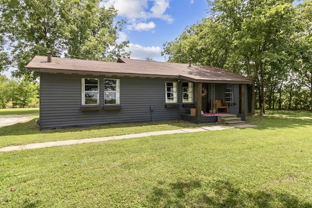 601 E San Saba St, Wortham, TX 76693 - rear view of house with a yard and a shingled roof