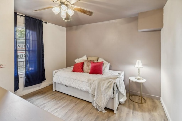 601 E San Saba St, Wortham, TX 76693 - bedroom with wood finished floors and ceiling fan