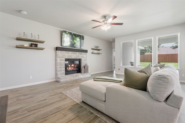 1420 Whitetail Ln, Azle, TX 76020 - living area with a ceiling fan, wood finished floors, and a stone fireplace