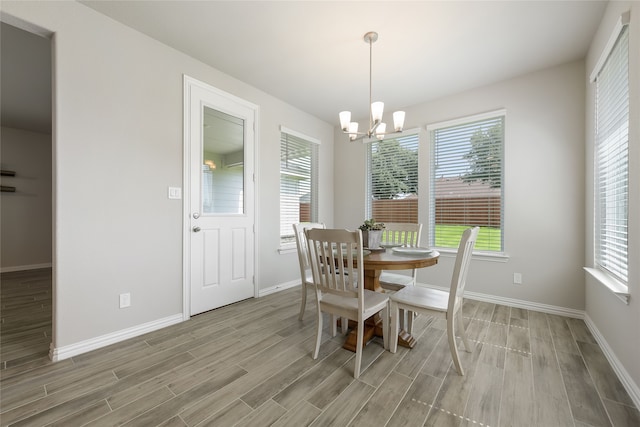 1420 Whitetail Ln, Azle, TX 76020 - dining space with light wood finished floors, a chandelier, and healthy amount of natural light