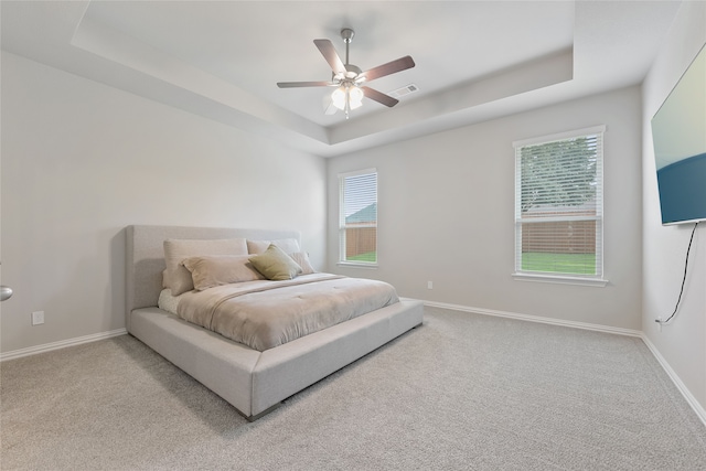1420 Whitetail Ln, Azle, TX 76020 - bedroom with a tray ceiling, carpet flooring, and ceiling fan