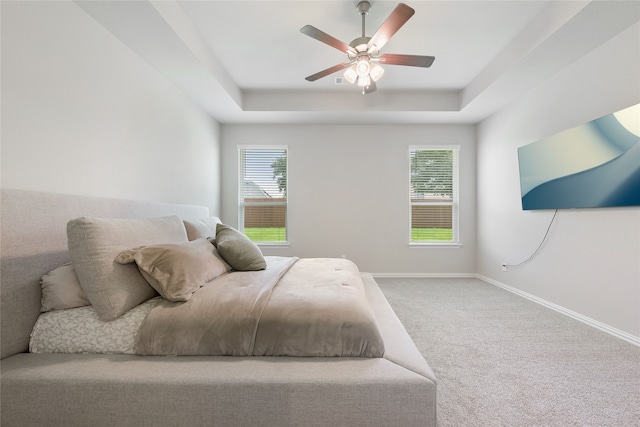 1420 Whitetail Ln, Azle, TX 76020 - carpeted bedroom with a tray ceiling and a ceiling fan