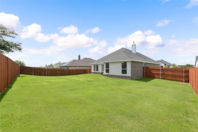 1420 Whitetail Ln, Azle, TX 76020 - back of property with a fenced backyard, brick siding, and a chimney