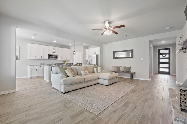 1420 Whitetail Ln, Azle, TX 76020 - living room featuring light wood-style floors, a ceiling fan, and recessed lighting