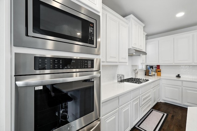 4336 Westminster Ave, Celina, TX 76227 - kitchen featuring stainless steel appliances, white cabinets, backsplash, light countertops, and recessed lighting