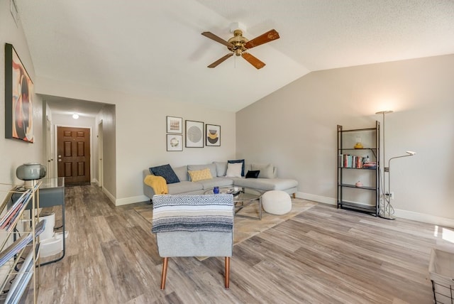 1833 Alonsdale Dr, Garland, TX 75040 - living room with ceiling fan, vaulted ceiling, and light wood-type flooring