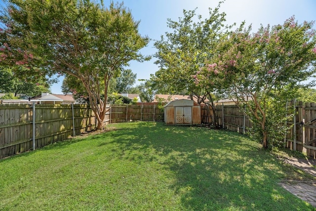 1833 Alonsdale Dr, Garland, TX 75040 - fenced backyard featuring a storage unit
