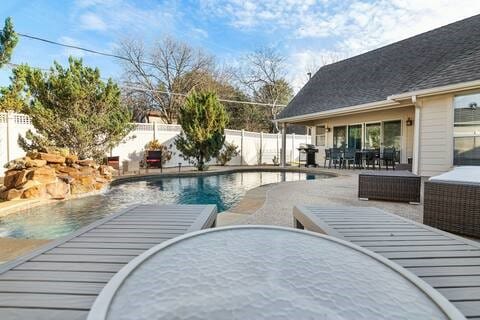 1918 Palace Dr, Grand Prairie, TX 75050 - view of swimming pool featuring a fenced backyard, outdoor dining area, and a patio area