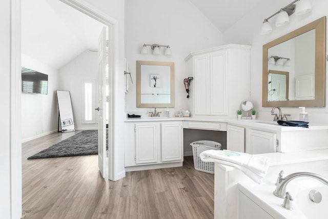 1918 Palace Dr, Grand Prairie, TX 75050 - bathroom with vaulted ceiling, wood finished floors, and double vanity