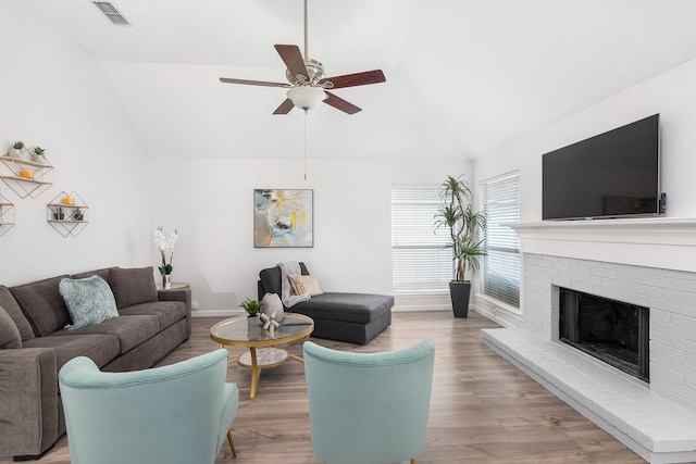 1918 Palace Dr, Grand Prairie, TX 75050 - living room featuring lofted ceiling, ceiling fan, light wood-style flooring, and a fireplace