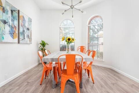 1918 Palace Dr, Grand Prairie, TX 75050 - dining room with a chandelier and light wood-style flooring