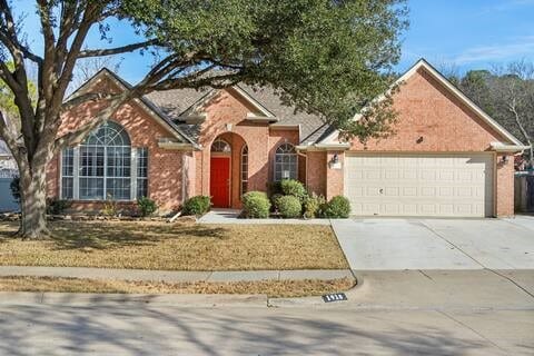 1918 Palace Dr, Grand Prairie, TX 75050 - traditional home with a garage and driveway