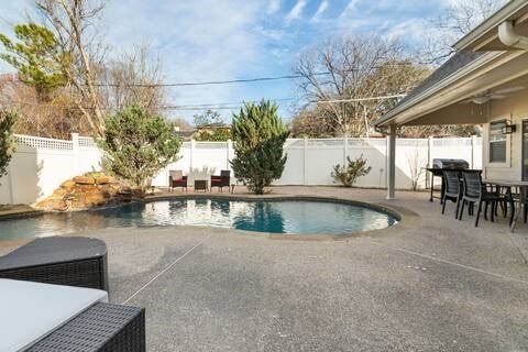 1918 Palace Dr, Grand Prairie, TX 75050 - view of swimming pool with a patio, a ceiling fan, and a fenced backyard