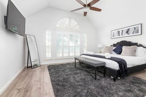 1918 Palace Dr, Grand Prairie, TX 75050 - bedroom featuring wood finished floors, lofted ceiling, and a ceiling fan