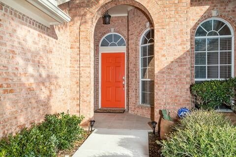 1918 Palace Dr, Grand Prairie, TX 75050 - doorway to property with brick siding