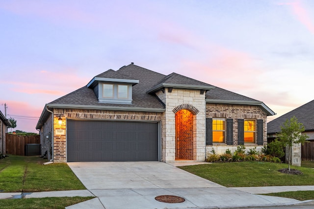 2102 Clearwater Way, Royse City, TX 75189 - french country style house with roof with shingles, concrete driveway, a garage, and brick siding