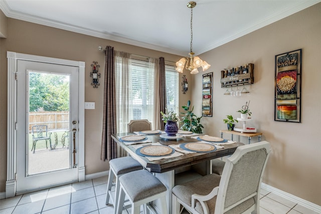 701 Parkhill Dr, Mansfield, TX 76063 - dining room featuring a chandelier, ornamental molding, and light tile patterned floors