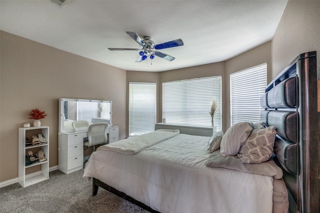 701 Parkhill Dr, Mansfield, TX 76063 - carpeted bedroom with multiple windows and a ceiling fan